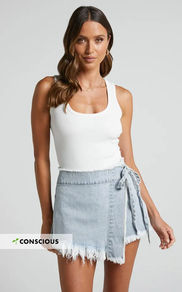 Showpo Ellyza Skort 8211 Recycled Cotton Frayed Edge Wrap Denim Skort In Mid Blue Wash Women Shop Conscious Showpo Ellyza Skort 8211 Recycled Cotton Frayed Edge Wrap Denim Skort In Mid Blue Wash Women Shop Conscious