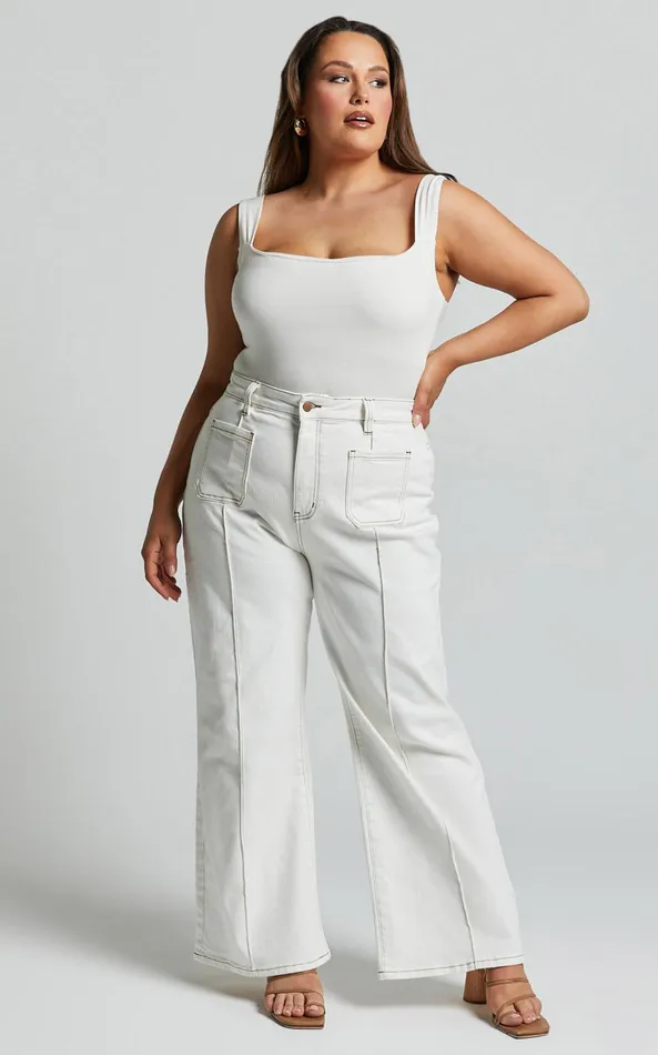 Showpo Malcolm Jeans 8211 Mid Rise Contrast Stitch Flared Denim Jeans In White Denim Women Curve Clothes