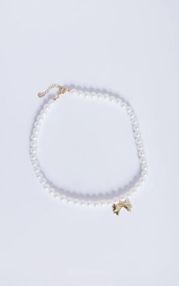 Showpo Wallace Necklace 8211 Bow Shaped Pearl Necklace In Gold Women Necklaces