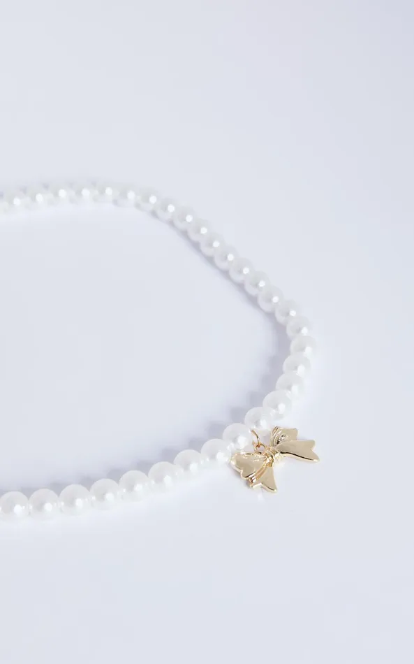 Showpo Wallace Necklace 8211 Bow Shaped Pearl Necklace In Gold Women Necklaces